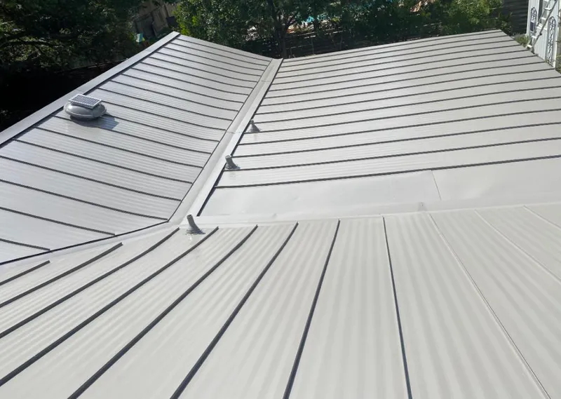 Solar attic fan installed on a metal roof for Roof Ventilation in Spring Garden